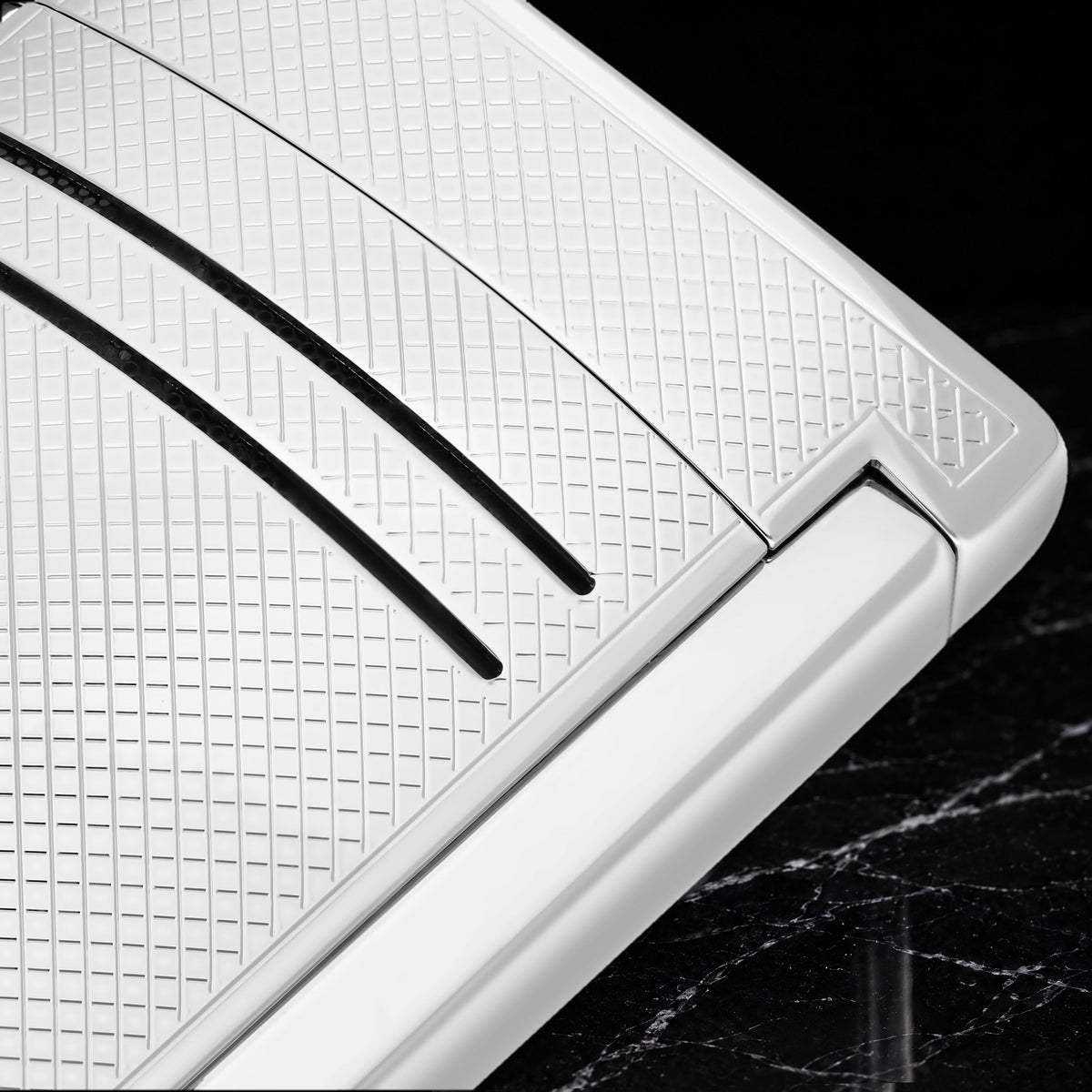 Close-up of the S.T. Dupont Maxijet chrome grid texture and the two vent slots