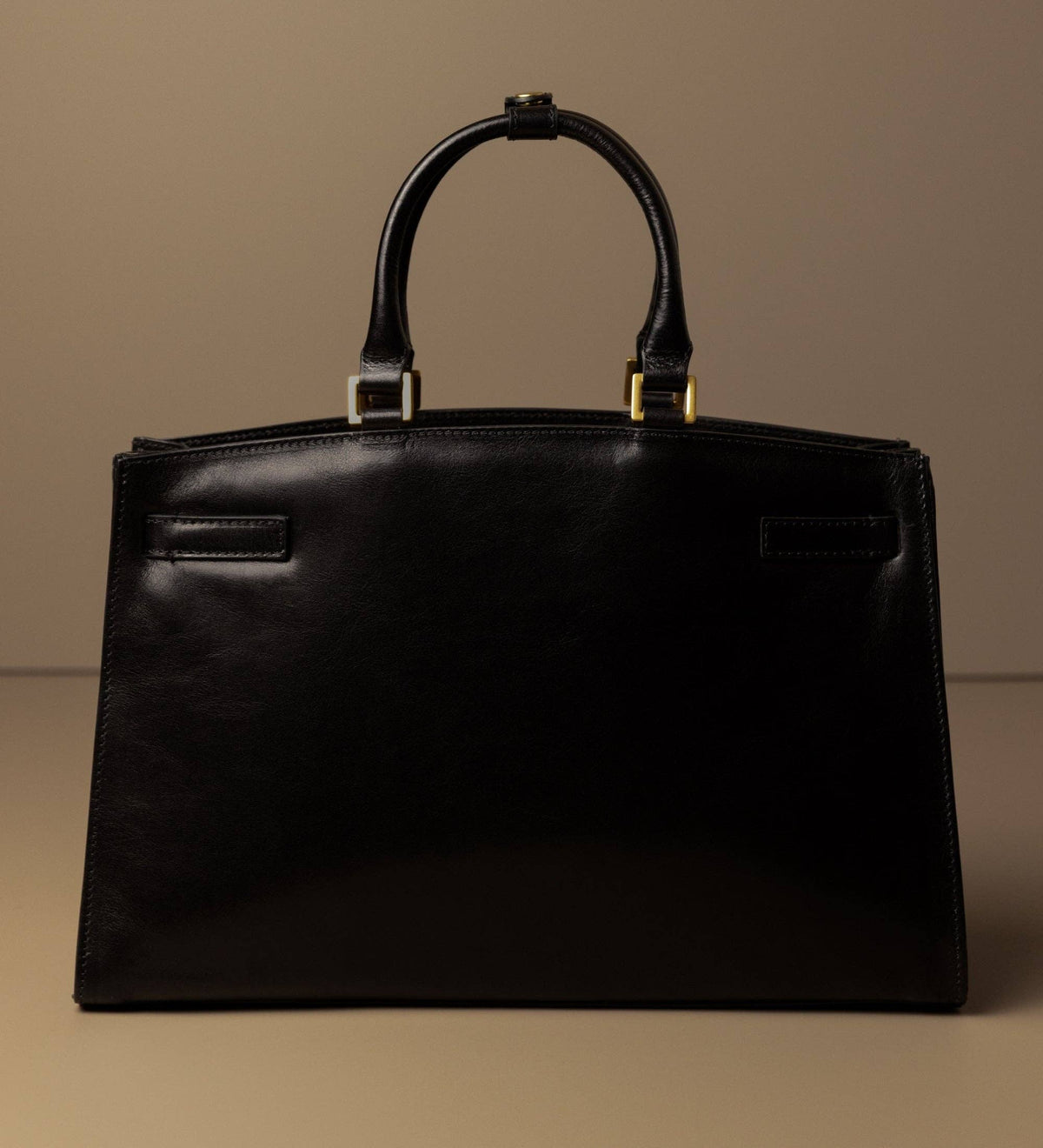 Shirley black leather work tote by Time Resistance — front view, standing upright with handles raised