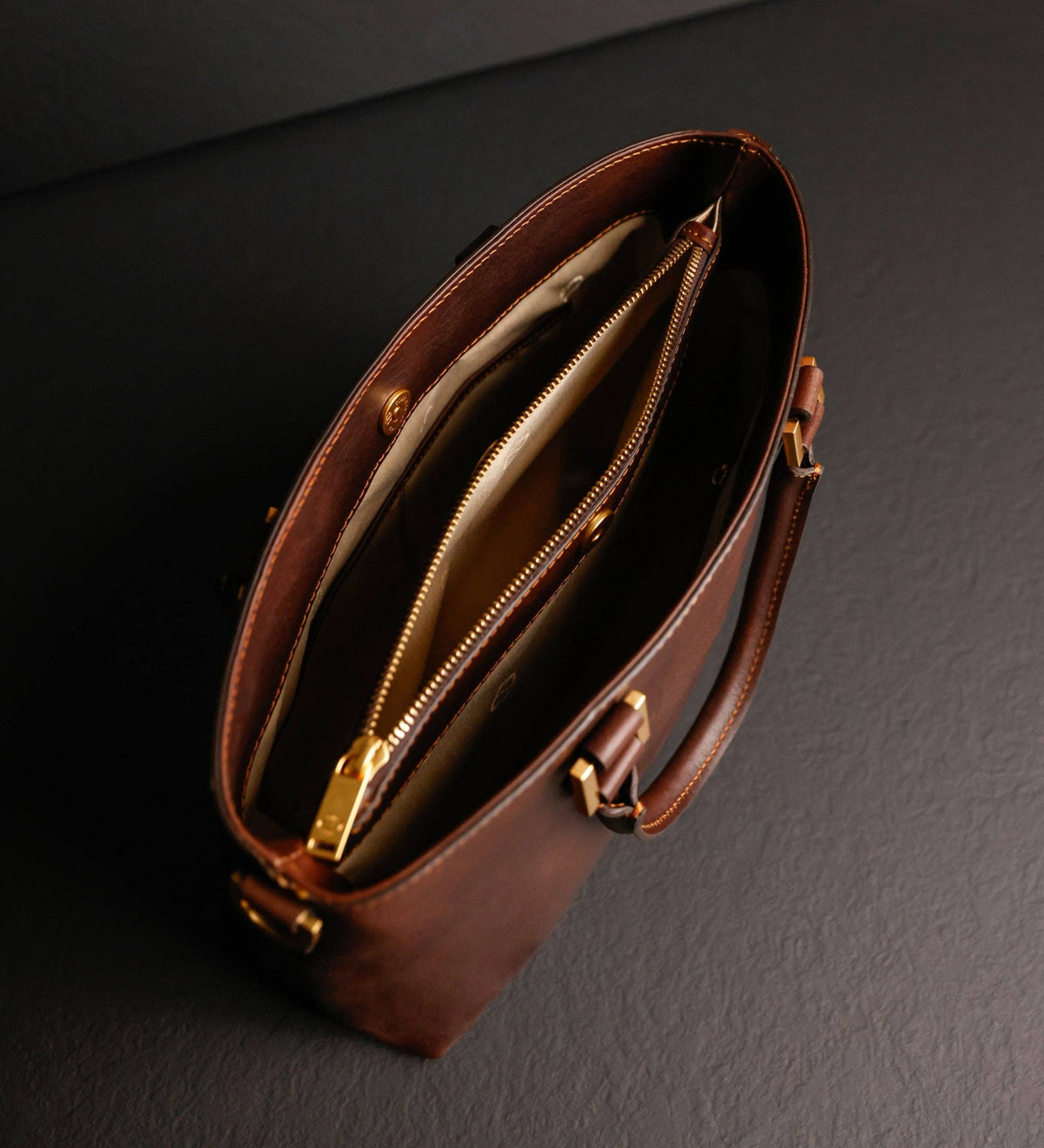 Camilla — top open, showing the lined interior and center divider