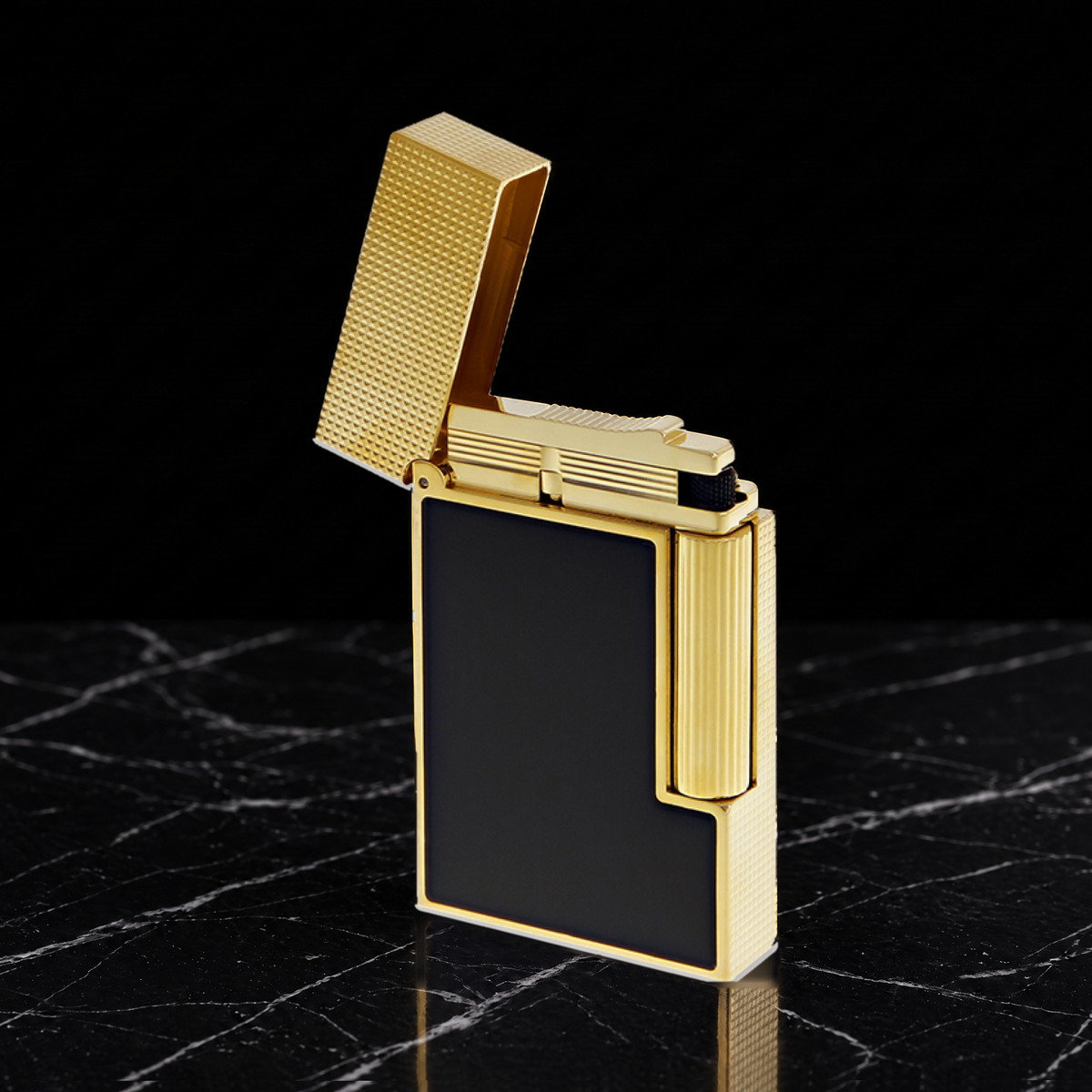 S.T. Dupont Ligne 2 Perfect Ping lighter in black lacquer with gold trim, hinged cap open above the burner