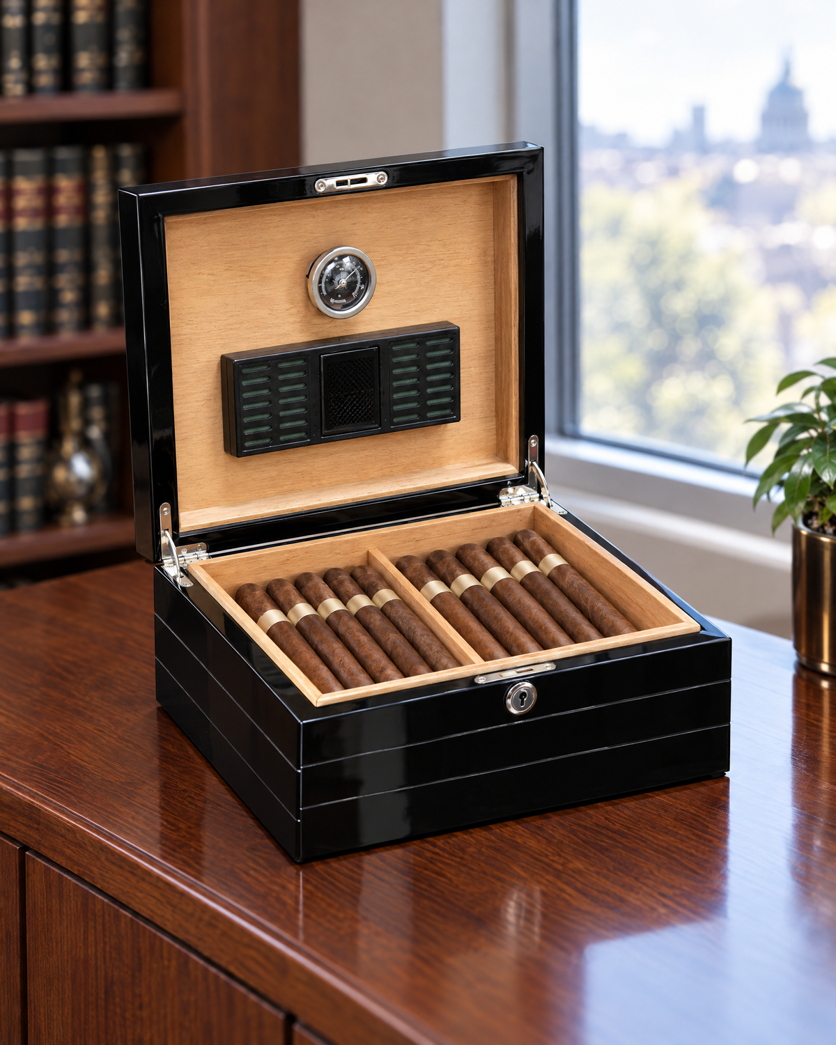 The Onyx 50-cigar humidor open on a credenza, cedar interior with hygrometer and humidifier in the lid and two rows of cigars