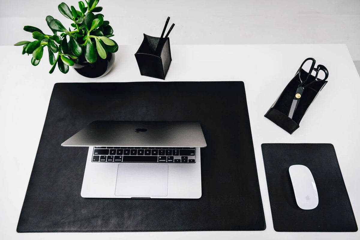 Carter Leather Desk Pad in black in the office — lifestyle