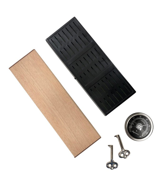 The Onyx humidor accessories — cedar divider, humidifier and key
