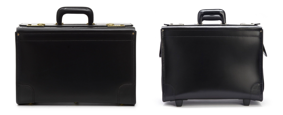 The Workhorse hand-carry catalog case and the wheeled Litigator side by side at true relative size, both in black leather