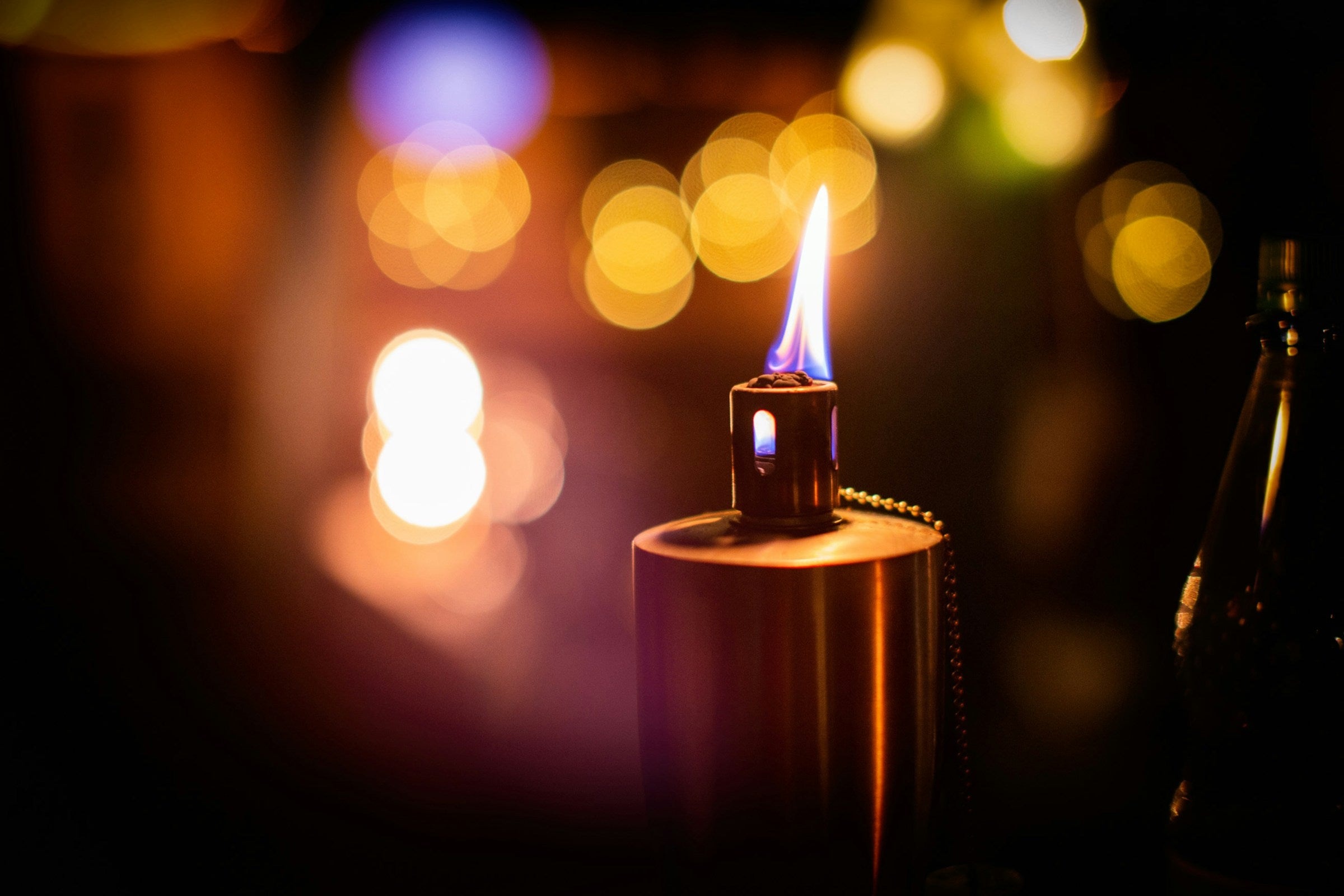 Close-up of a silver-and-gold flip lighter