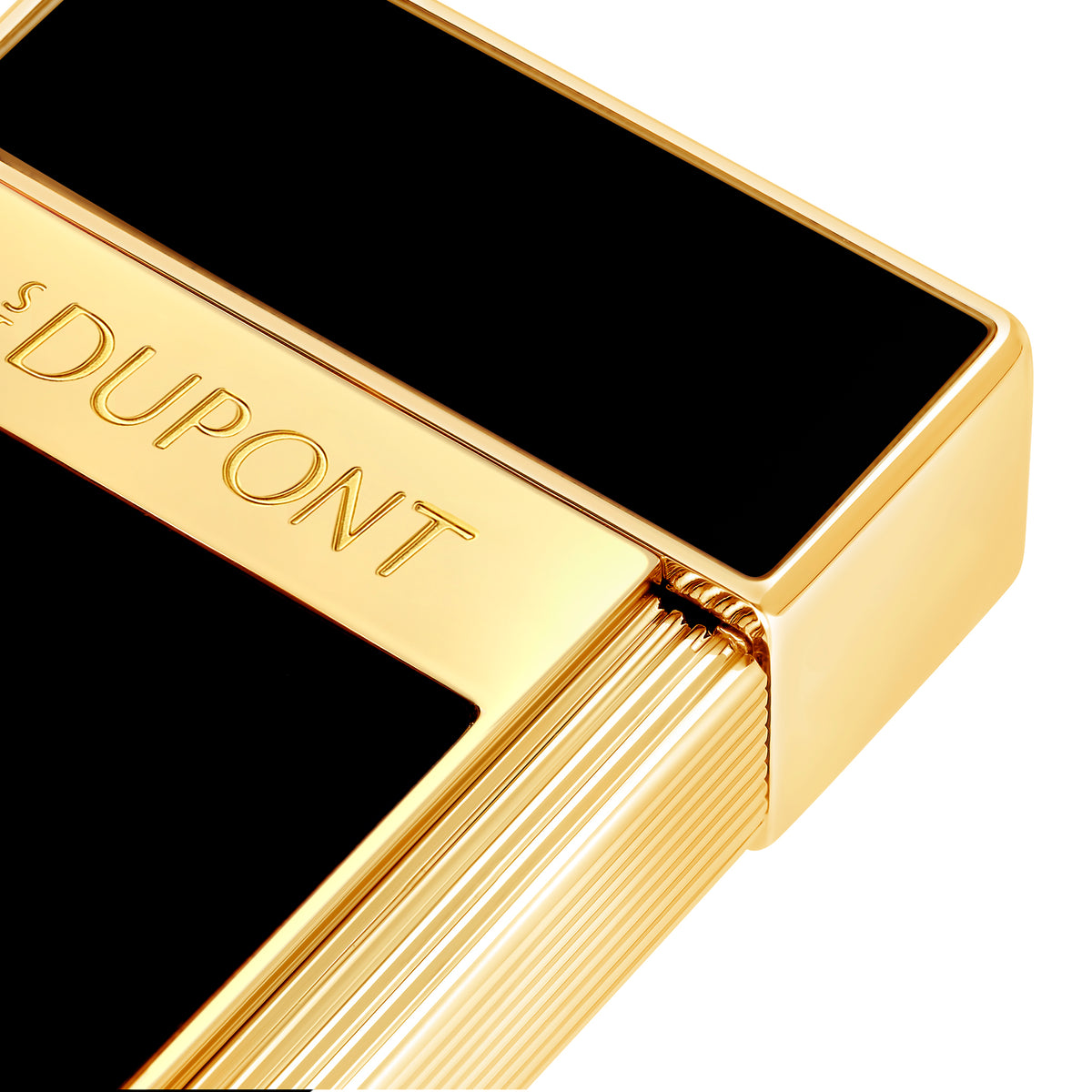 Close-up of the S.T. Dupont Biggy lighter in black lacquer, showing the engraved S.T. Dupont band and fluted gold roller