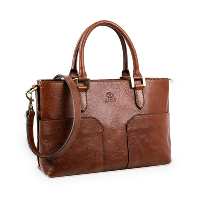 Camilla — three-quarter view with the shoulder strap attached and embossed maker's mark