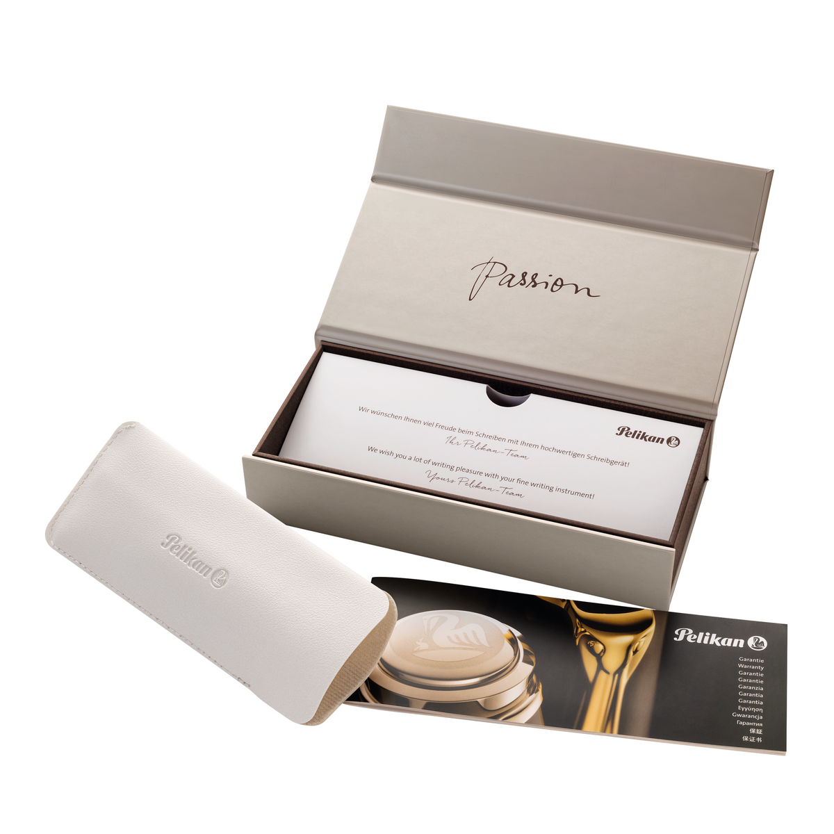 Pelikan presentation box open, showing a white leather pen sleeve, the warranty booklet and a printed inner lid