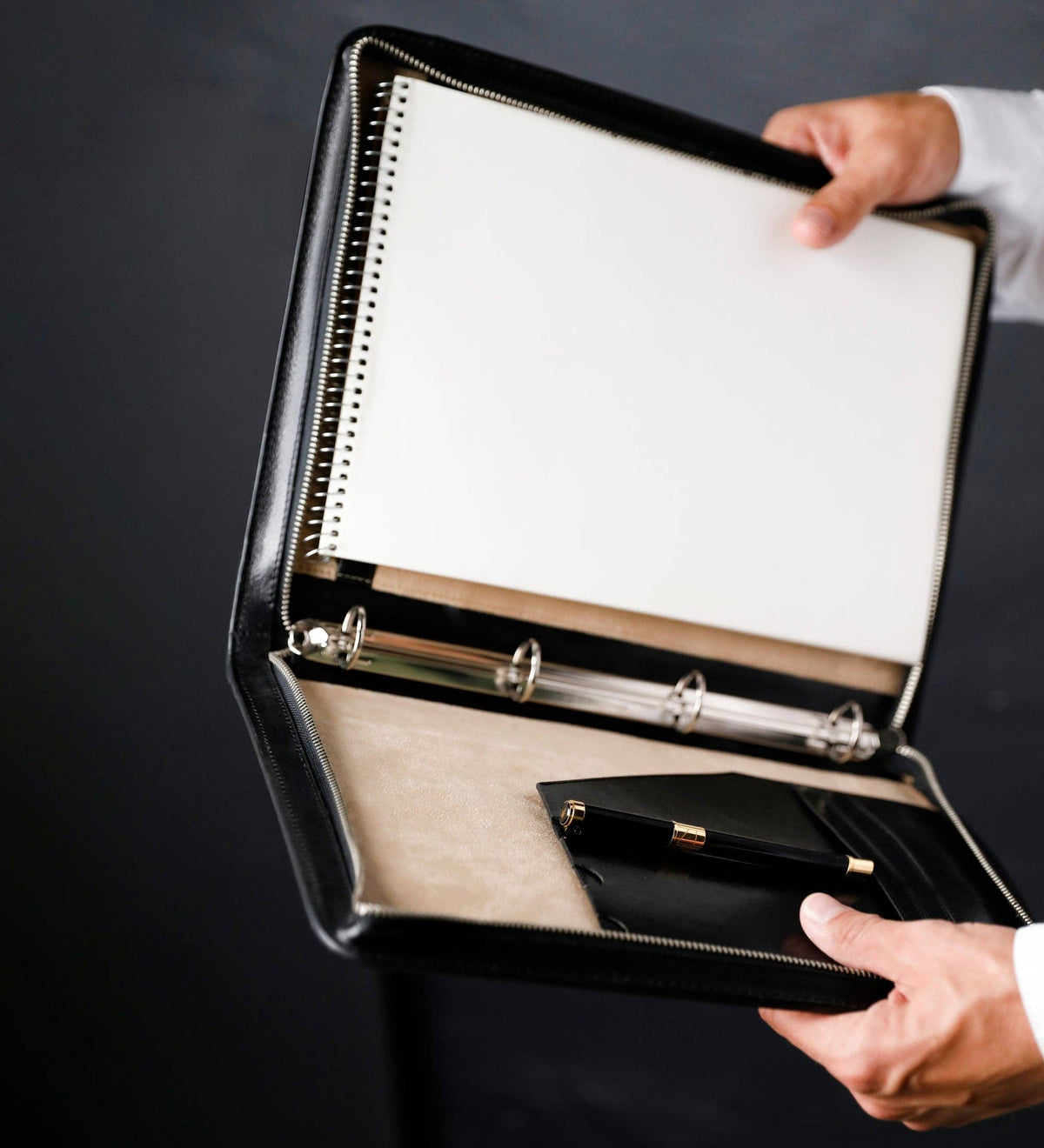 Joy in the Morning — four-ring binder mechanism with a punched page being mounted