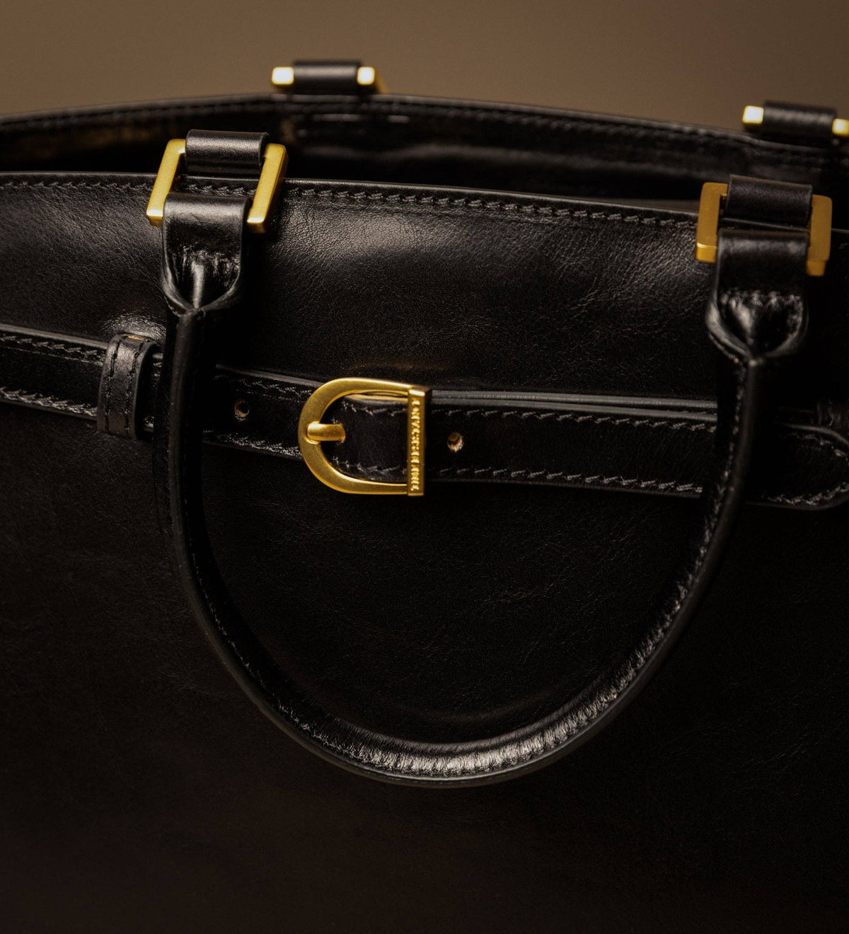 Shirley — close-up of the front buckle, brass hardware, and stitching