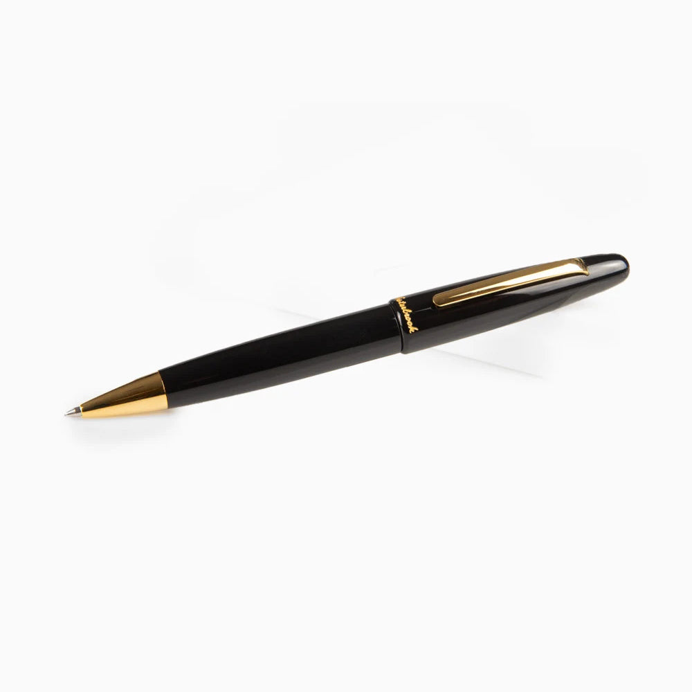 Esterbrook Estie Ballpoint in Ebony with gold trim, shown uncapped with the cap posted on the back of the barrel, the gold ballpoint cone at the writing end and the flat gold clip on the cap