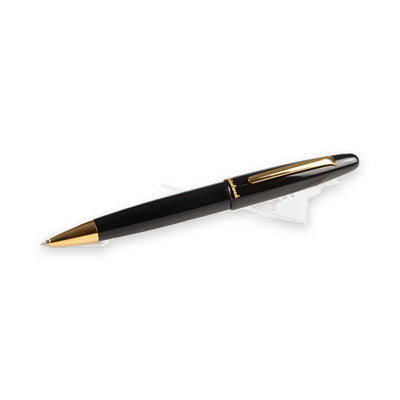 Esterbrook Estie Ballpoint in Ebony with gold trim, shown uncapped with the cap posted on the back of the barrel, the gold ballpoint cone at the writing end and the flat gold clip on the cap