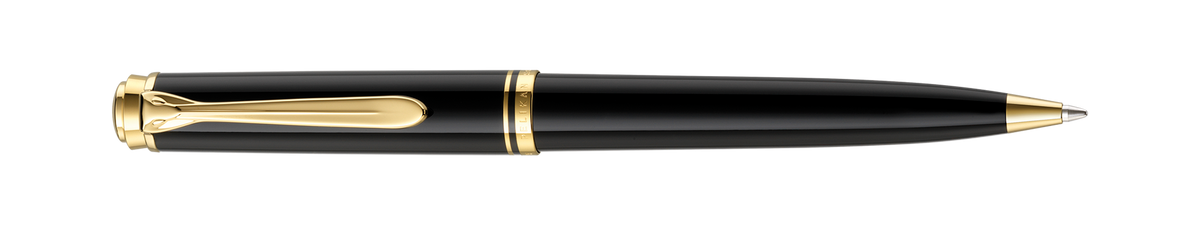 Pelikan Souverän K800 ballpoint in black resin with gold-plated trim, shown full length horizontally with the tip extended