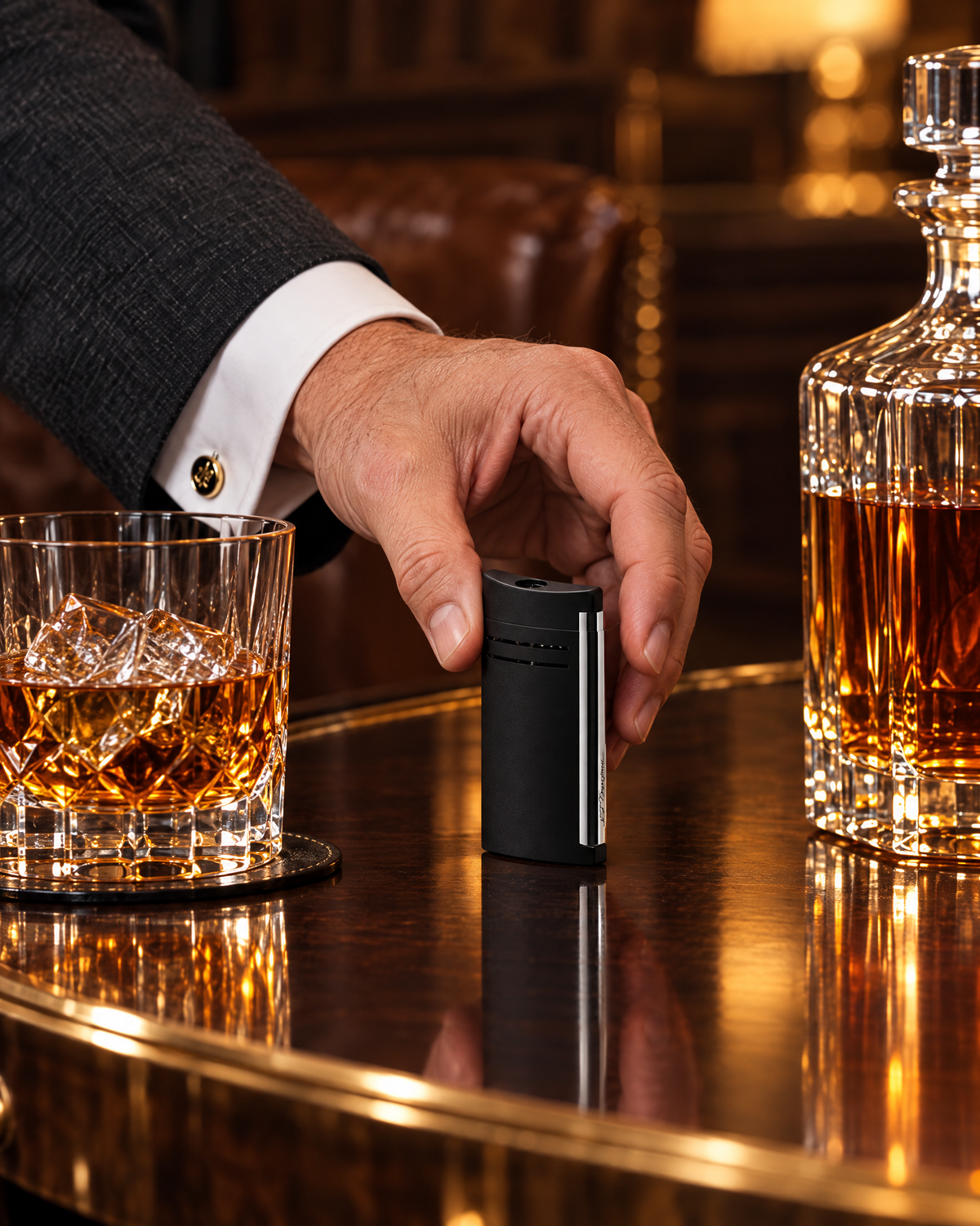 S.T. Dupont Maxijet Lighter — Matte Black, picked up from a side table beside bourbon and a decanter