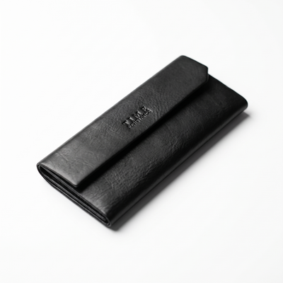 The Riddle of the Sands — Women's Leather Glasses Case in black pebbled leather, lying flat at an angle, on a white background