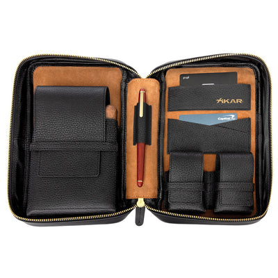 Xikar Sentinel case open and lined in tan suede, showing the main cigar pocket, a pen in its leather loop, three card pockets and two small pockets for a lighter and cutter