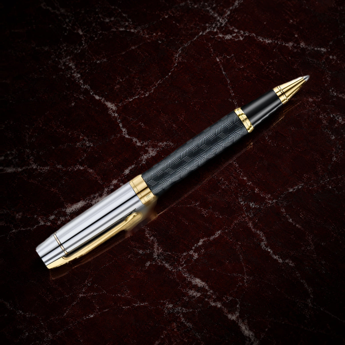Sheaffer 300 Pen — Engraved Matte Black with Chrome Cap: the rollerball with an engraved matte black barrel, chrome cap and PVD gold trim, on garnet marble