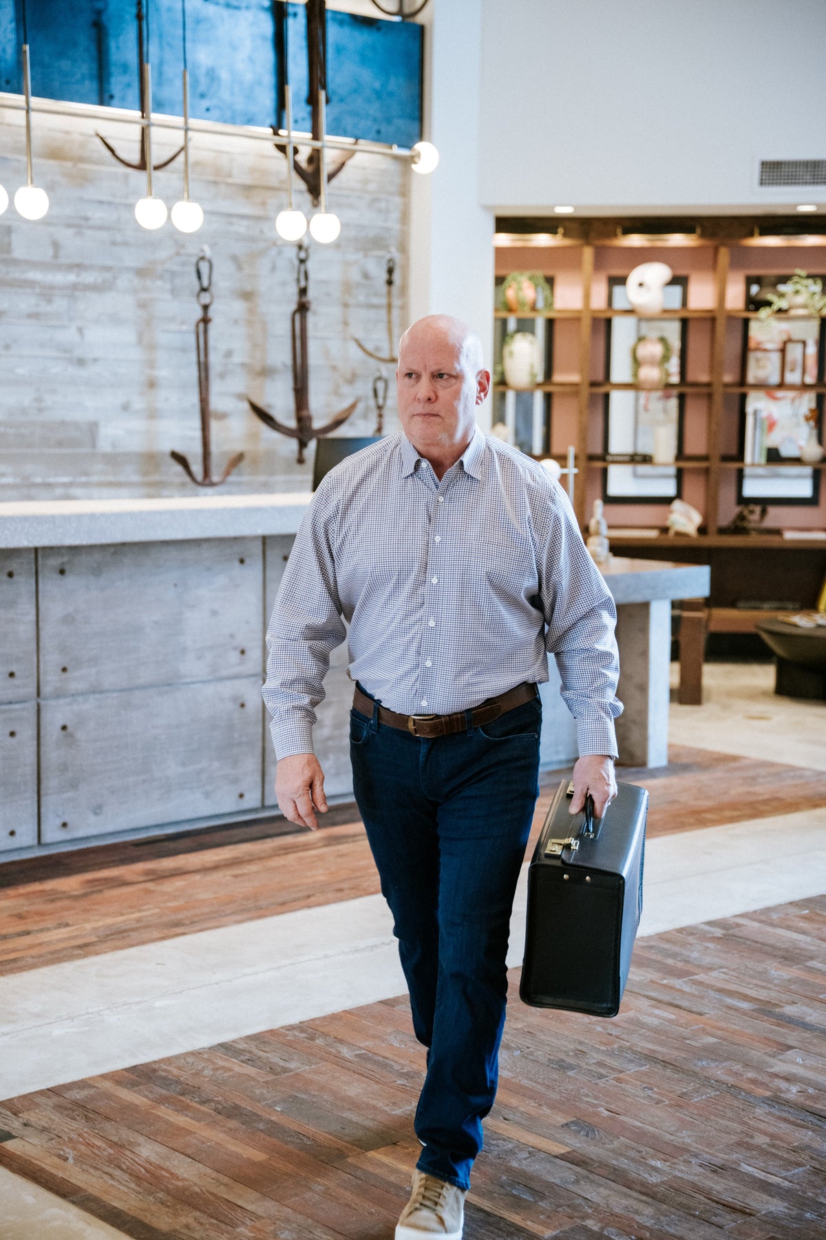 Workhorse Catalog Case carried in hand — lifestyle