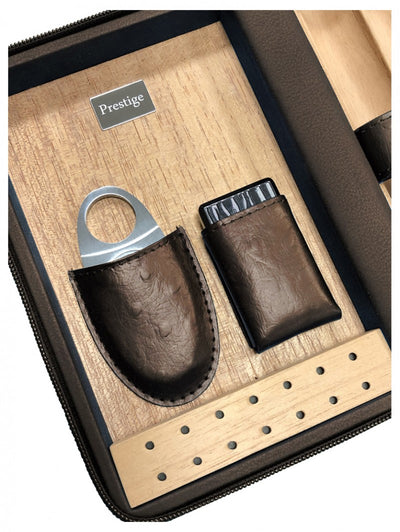 Spanish cedar interior of The Manhattan travel humidor, with the included guillotine cutter and butane torch in fitted leather sleeves