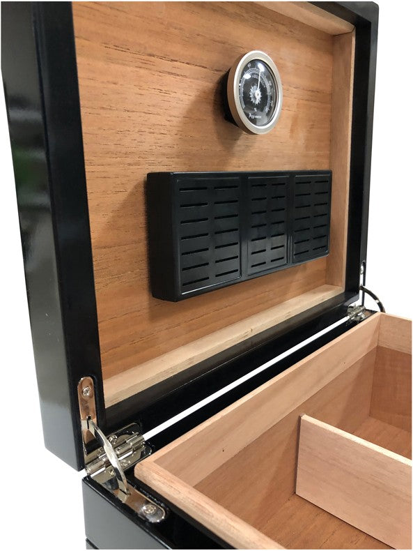 The Onyx humidor open at an angle, showing the lid hygrometer and black lacquer